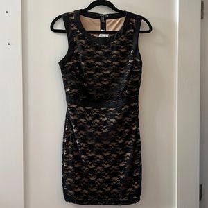 Forever 21. Size medium, black floral lace overlay on a tan coloured fabric.